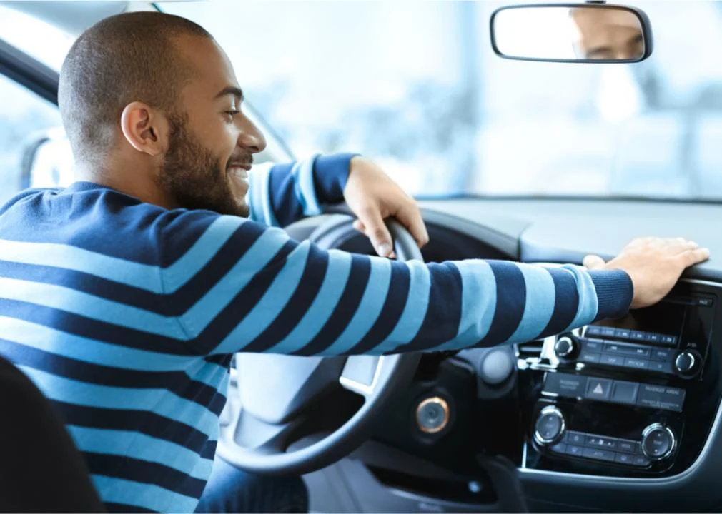 Photo of man driving a car