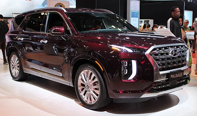 Red Hyundai Palisade in a showroom