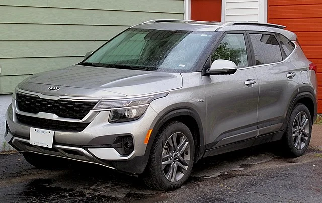 Silver Kia Seltos in a driveway