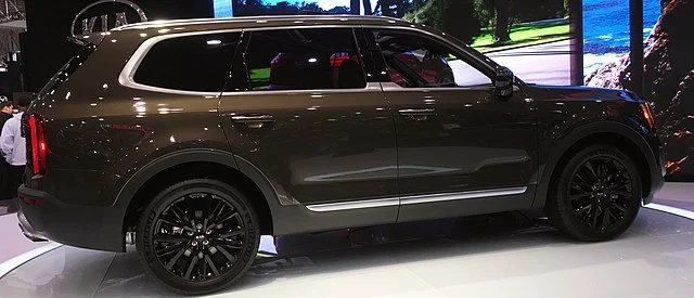 Dark grey Kia Telluride in a showroom