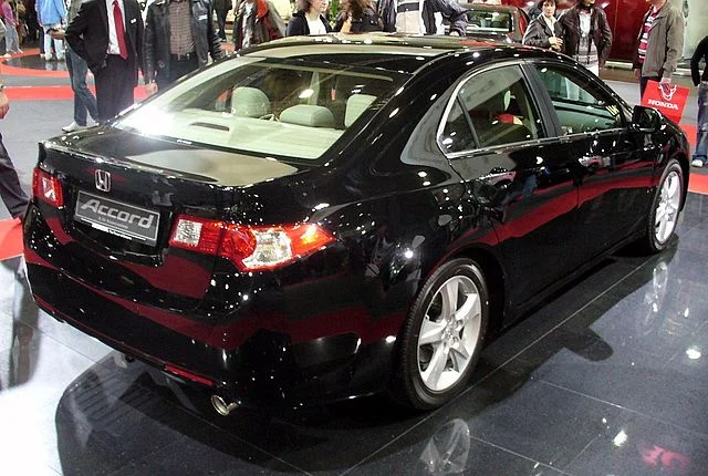 Black Honda Accord in a showroom