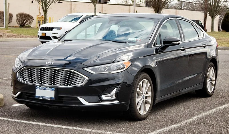 Black Ford Fusion Energi in a parking lot