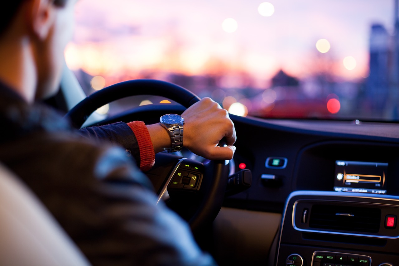 Photo of man driving car