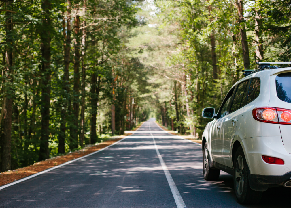 Photo of car driving on autumn road