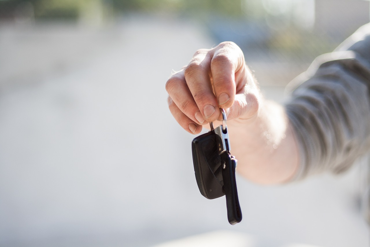 Photo of man holding car keys