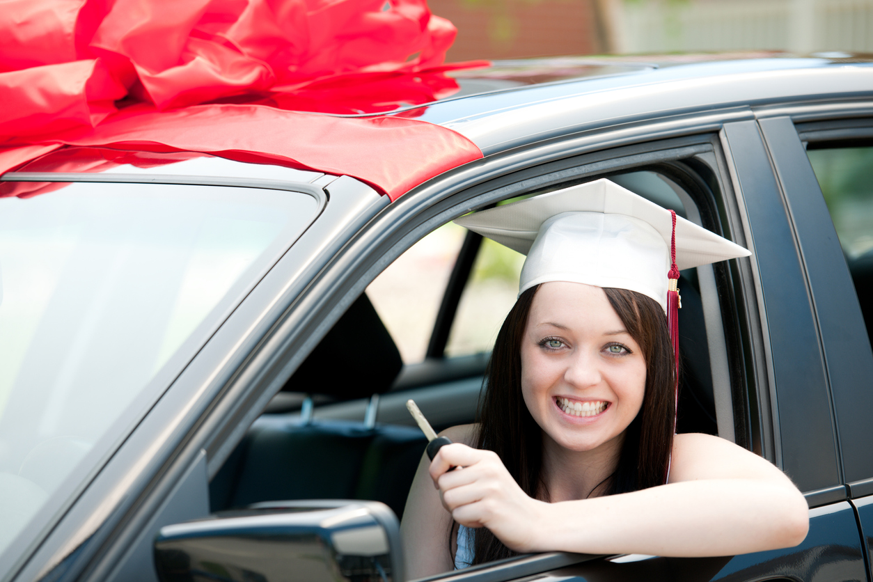 Photo of college graduate in car