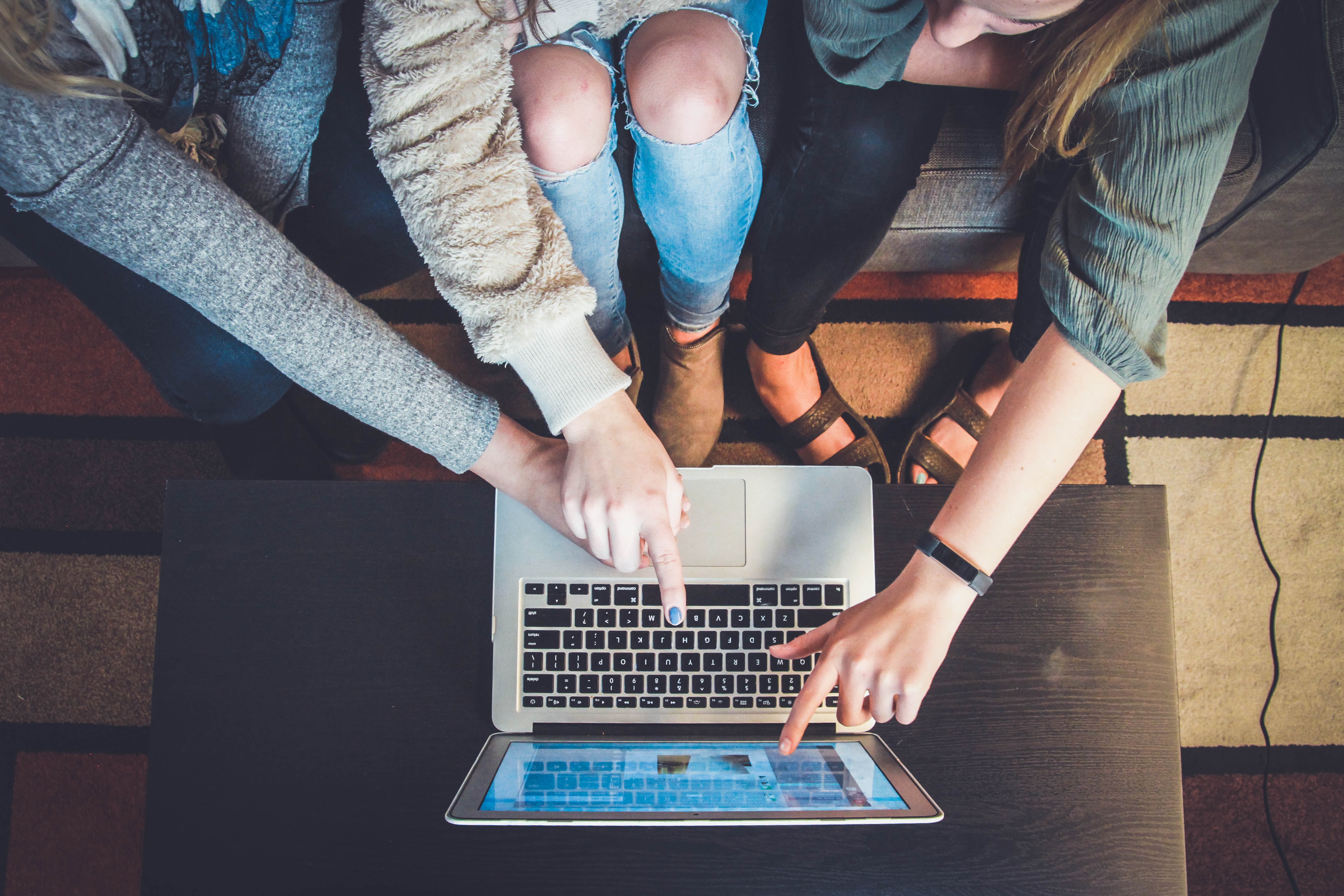 college students working on a laptop