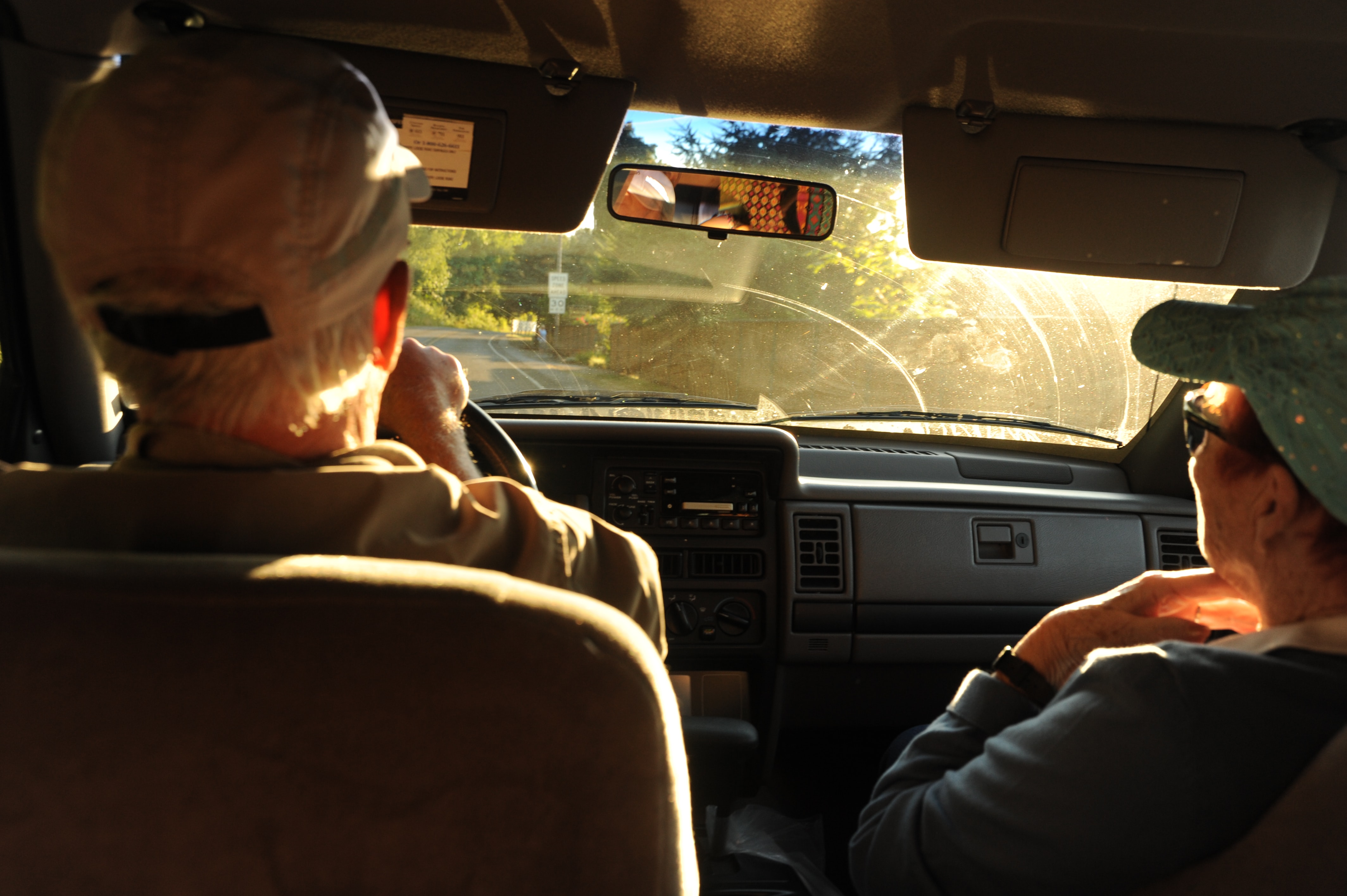 senior driving a car